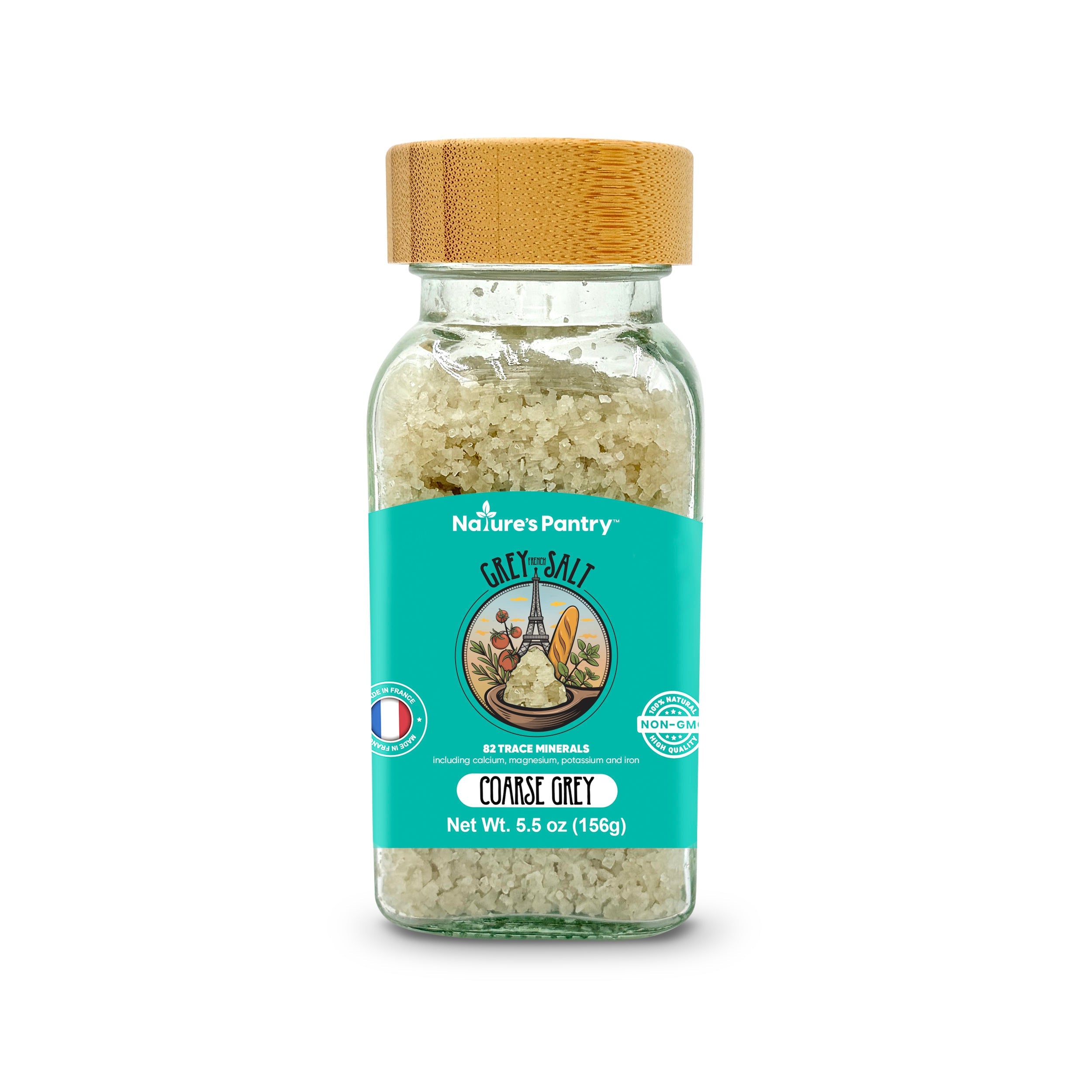 Glass jar of coarse gray salt with a wooden lid on a white background